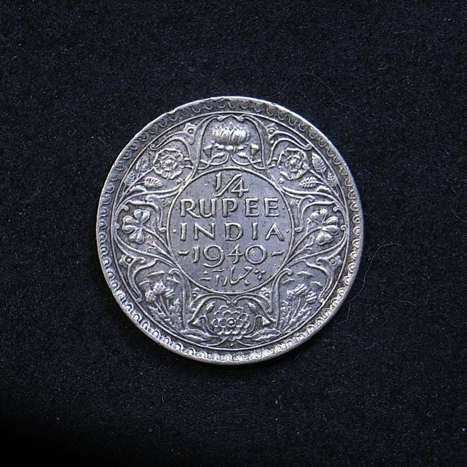 Close up of Indian Qtr rupee 1940 reverse showing the coin's detail